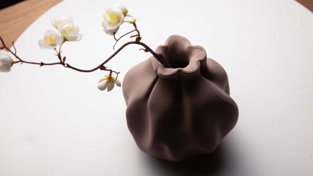 Aerial view of 3D printed vase that mimics fabric form.